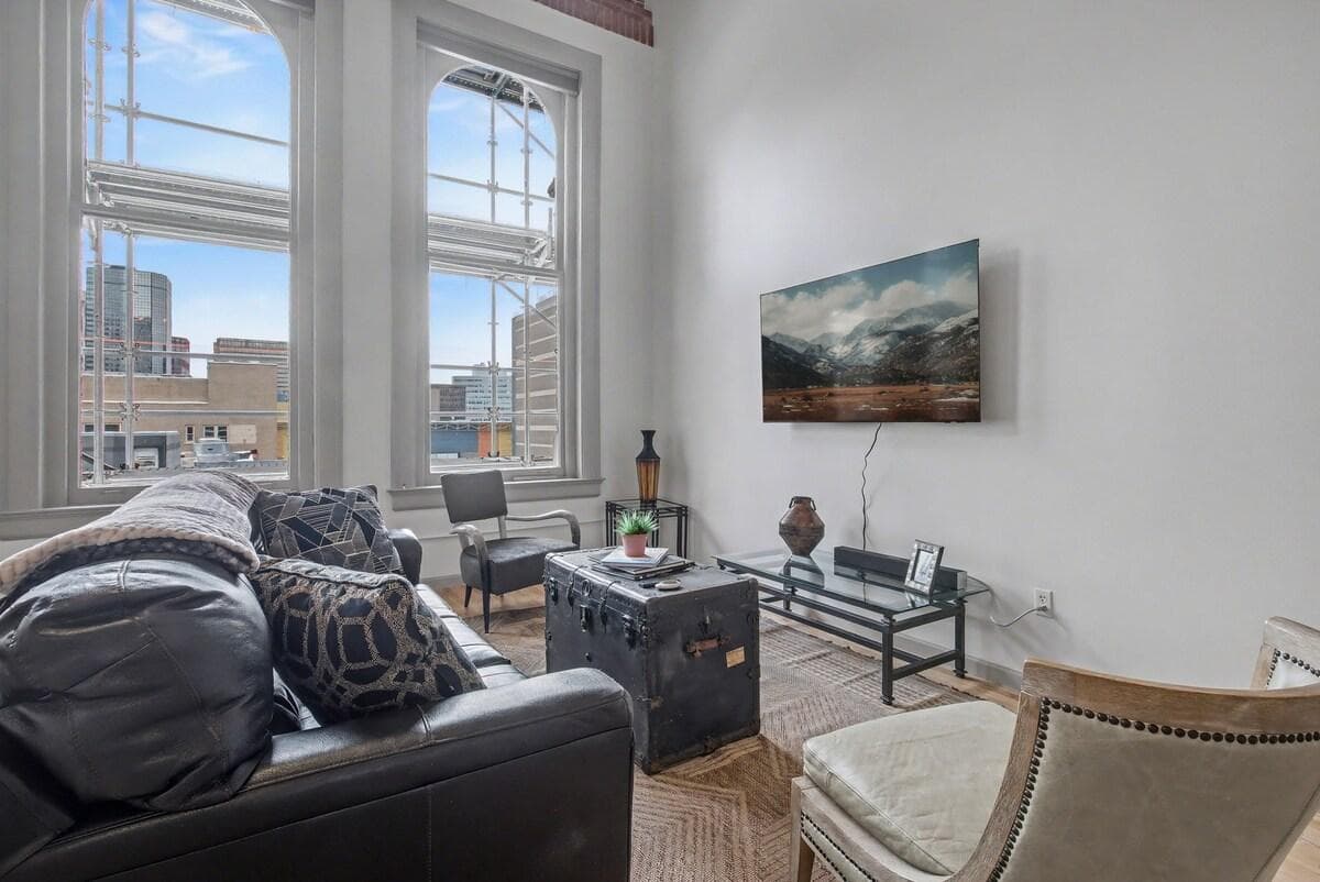 Living room with 65-inch smart TV with YouTube TV and hundreds of other app download options