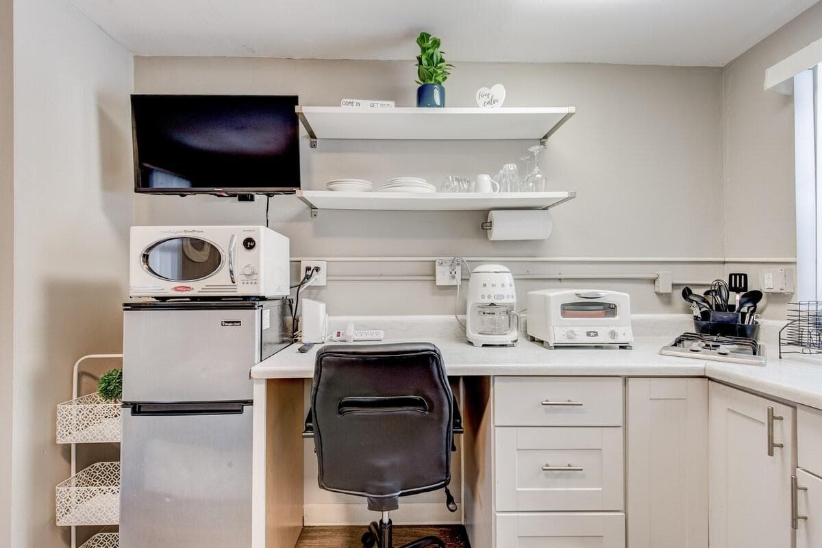 Brand new retro style appliances, your dedicated work station, and a fully-stocked kitchen area.