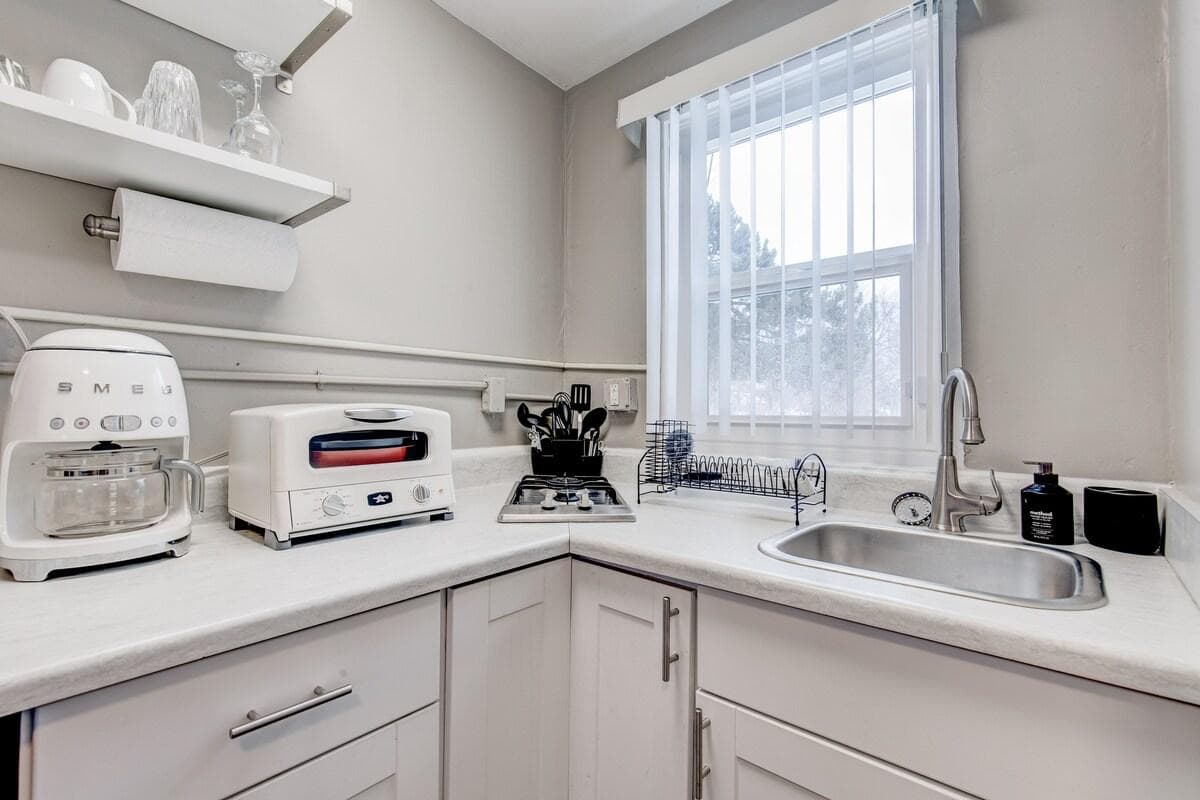 Smeg full-sized drip coffee maker, countertop oven with full functionalities, gas stove with two burners