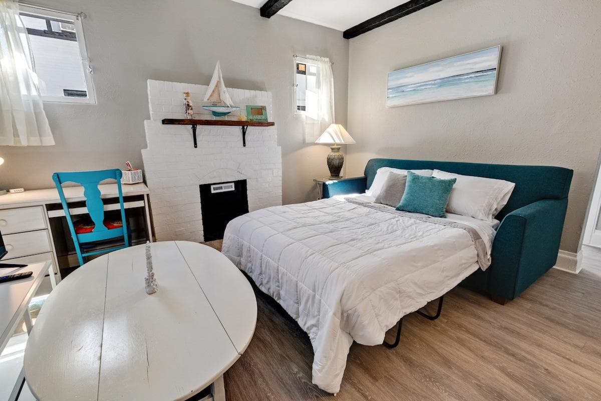 The sofa converts to a queen-sized bed with a brand new memory foam mattress, extra pillows and a blanket.