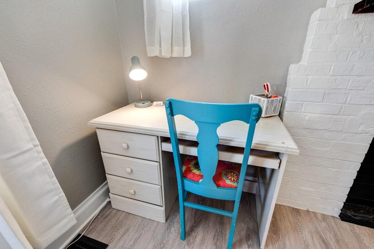 Your workstation with drawers, space for a laptop/monitor and keyboard, and desk supplies.